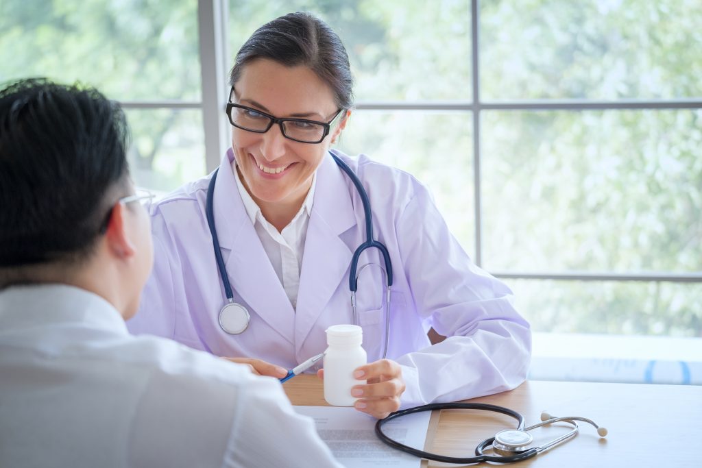 Doctor consulting patient about medication safety